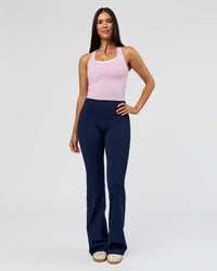 Woman wearing Fusion V-Contour High-Rise Flared Tall Legging Pockets - Future Navy | Model:Rosie | Size:S | Thumbnail Index: 1