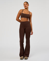 Woman wearing Fusion V-Contour High-Rise Flared Tall Legging Pockets - Hot Chocolate | Model:Rosie | Size:S | Thumbnail Index: 6