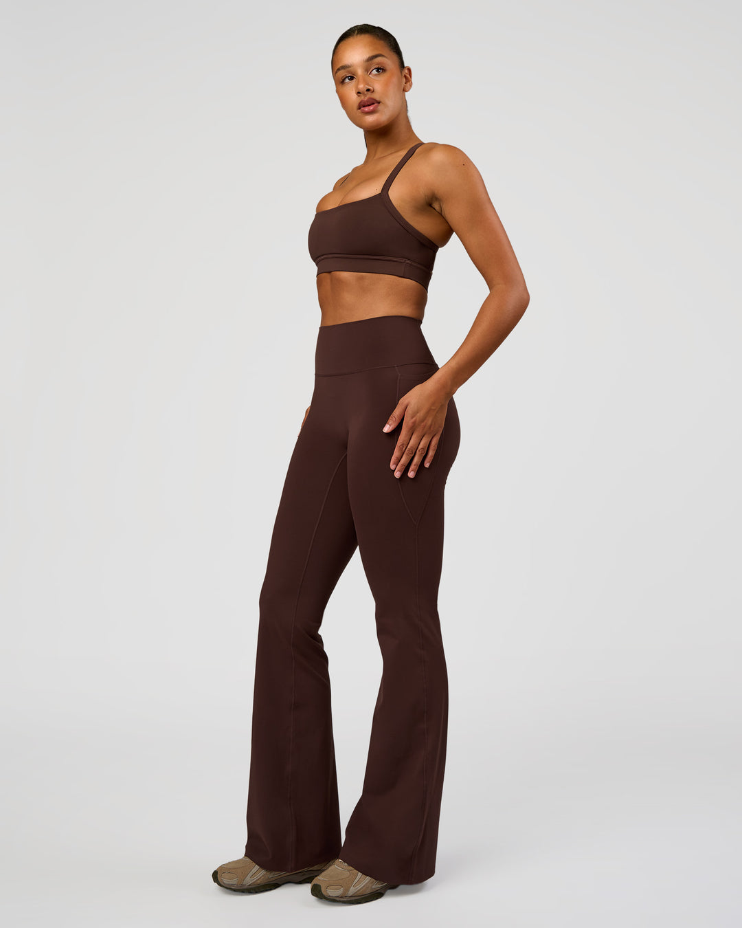Woman wearing Fusion V-Contour High-Rise Flared Tall Legging Pockets - Hot Chocolate | Model:Rosie | Size:S - view 8