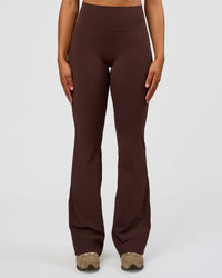 Woman wearing Fusion V-Contour High-Rise Flared Tall Legging Pockets - Hot Chocolate | Model:Rosie | Size:S | Thumbnail Index: 4