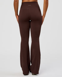 Woman wearing Fusion V-Contour High-Rise Flared Tall Legging Pockets - Hot Chocolate | Model:Rosie | Size:S | Thumbnail Index: 5