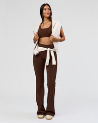 Woman wearing Fusion V-Contour High-Rise Flared Tall Legging Pockets - Hot Chocolate | Model:Rhiley | Size:S | Thumbnail Index: 3