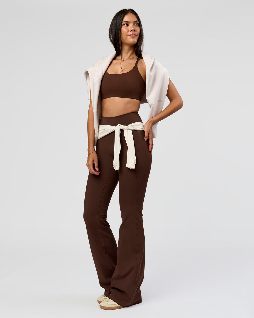 Woman wearing Fusion V-Contour High-Rise Flared Tall Legging Pockets - Hot Chocolate | Model:Rhiley | Size:S - view 9