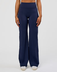 Woman wearing Fusion V-Contour High-Rise Tall Pant - Future Navy | Model:Rosie | Size:S | Thumbnail Index: 0