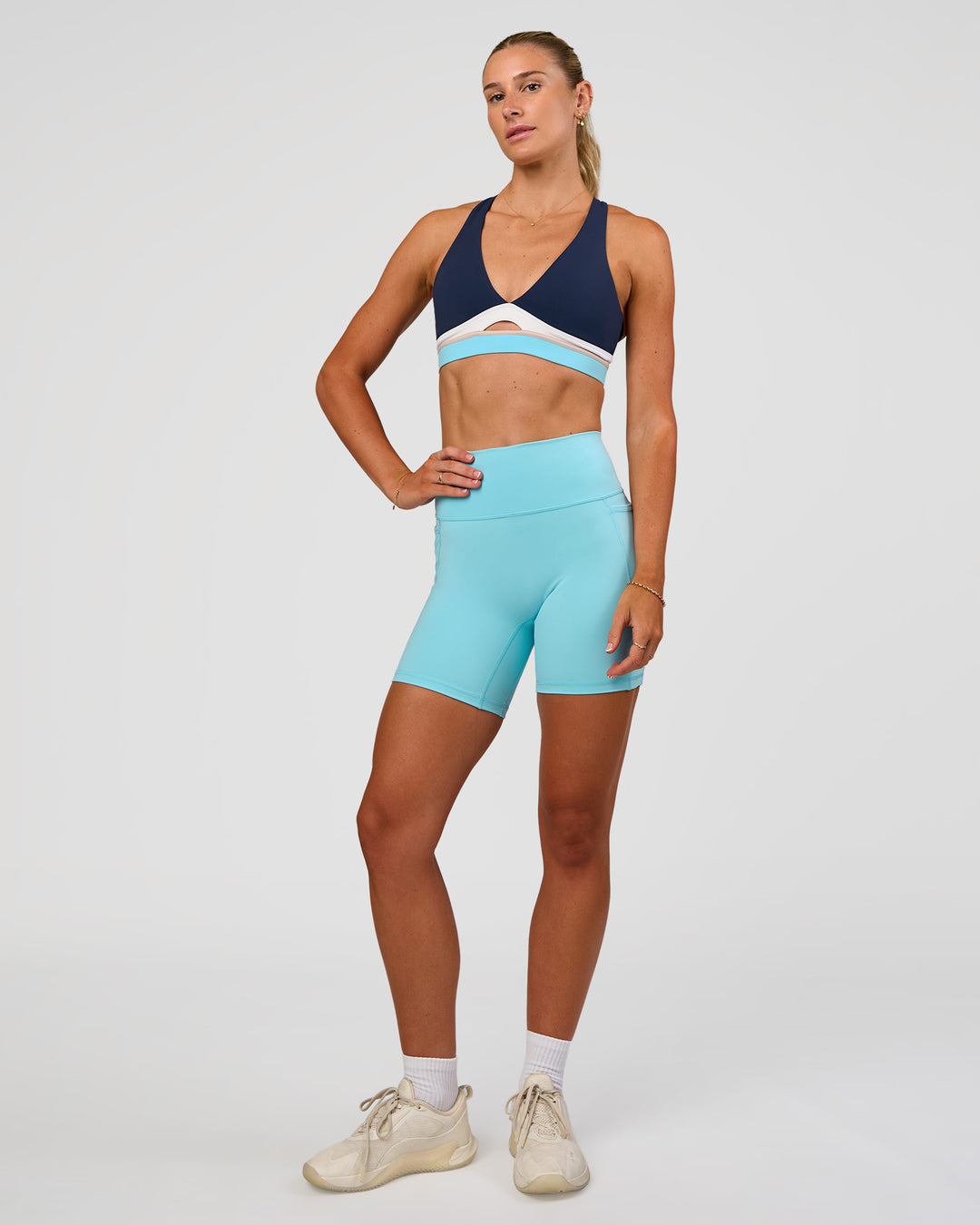 Woman wearing Fusion V-Contour Ultra High-Rise 6" Short Pockets - Baltic Sea | Model:Emelia | Size:S - view 4
