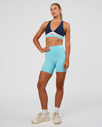 Woman wearing Fusion V-Contour Ultra High-Rise 6" Short Pockets - Baltic Sea | Model:Emelia | Size:S | Thumbnail Index: 3