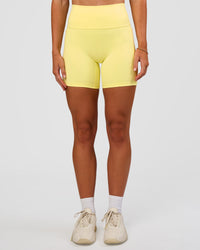 Woman wearing Fusion V-Contour Ultra High-Rise 6" Short Pockets - Yellow Fizz | Model:Emelia | Size:S | Thumbnail Index: 6