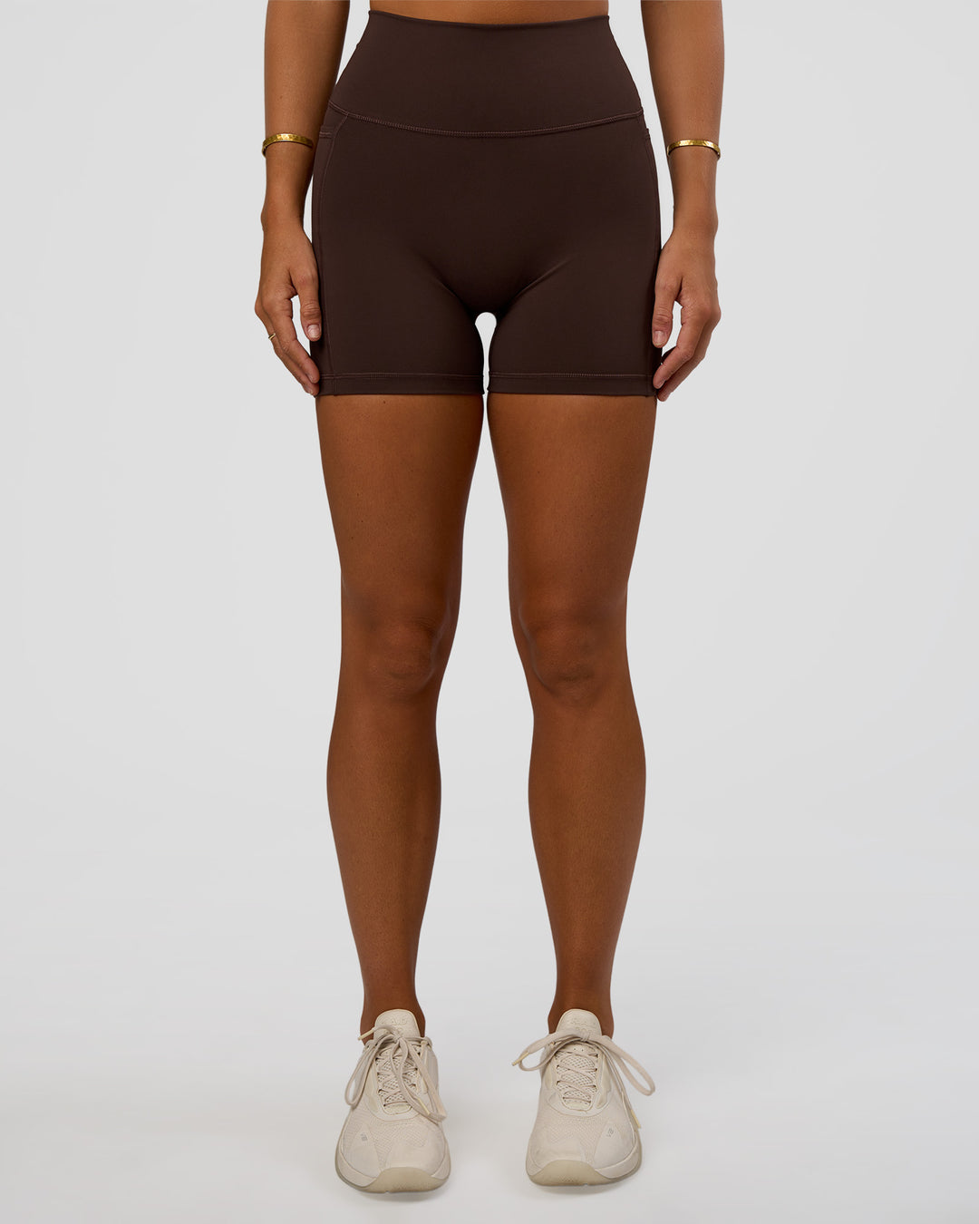 Woman wearing Fusion V-Contour Ultra High-Rise 4” Short Pockets - Hot Chocolate | Model:Amity | Size:S - view 7