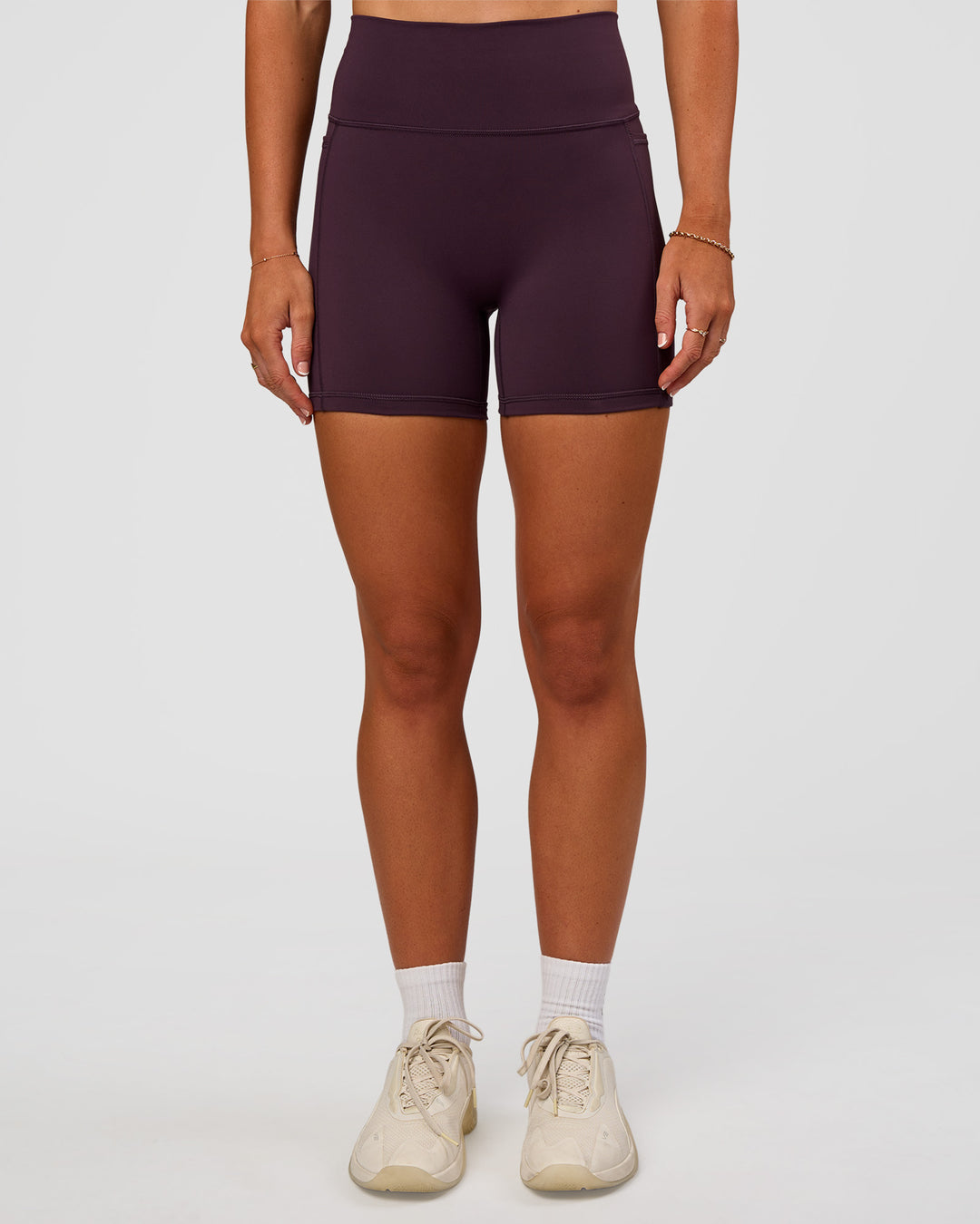 Woman wearing Fusion V-Contour Ultra High-Rise 4” Short Pockets - Midnight Plum | Model:Emelia | Size:S - view 8