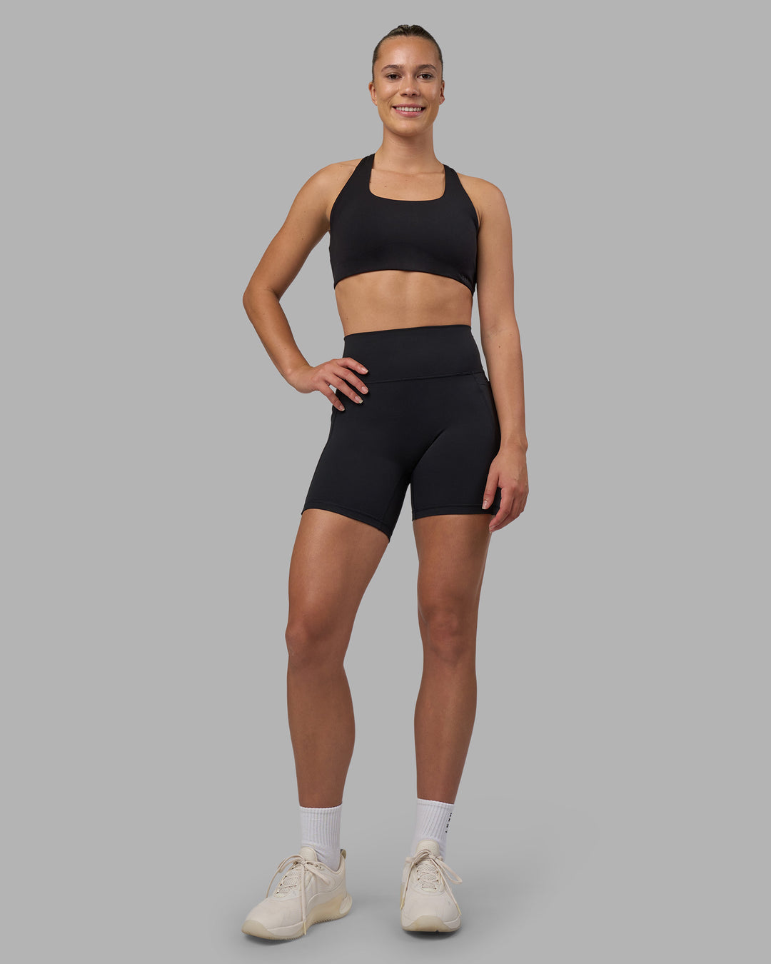 Woman wearing Fusion V-Contour Ultra High-Rise 6" Short Pockets - Black | Model:Charlize | Size:S - view 10