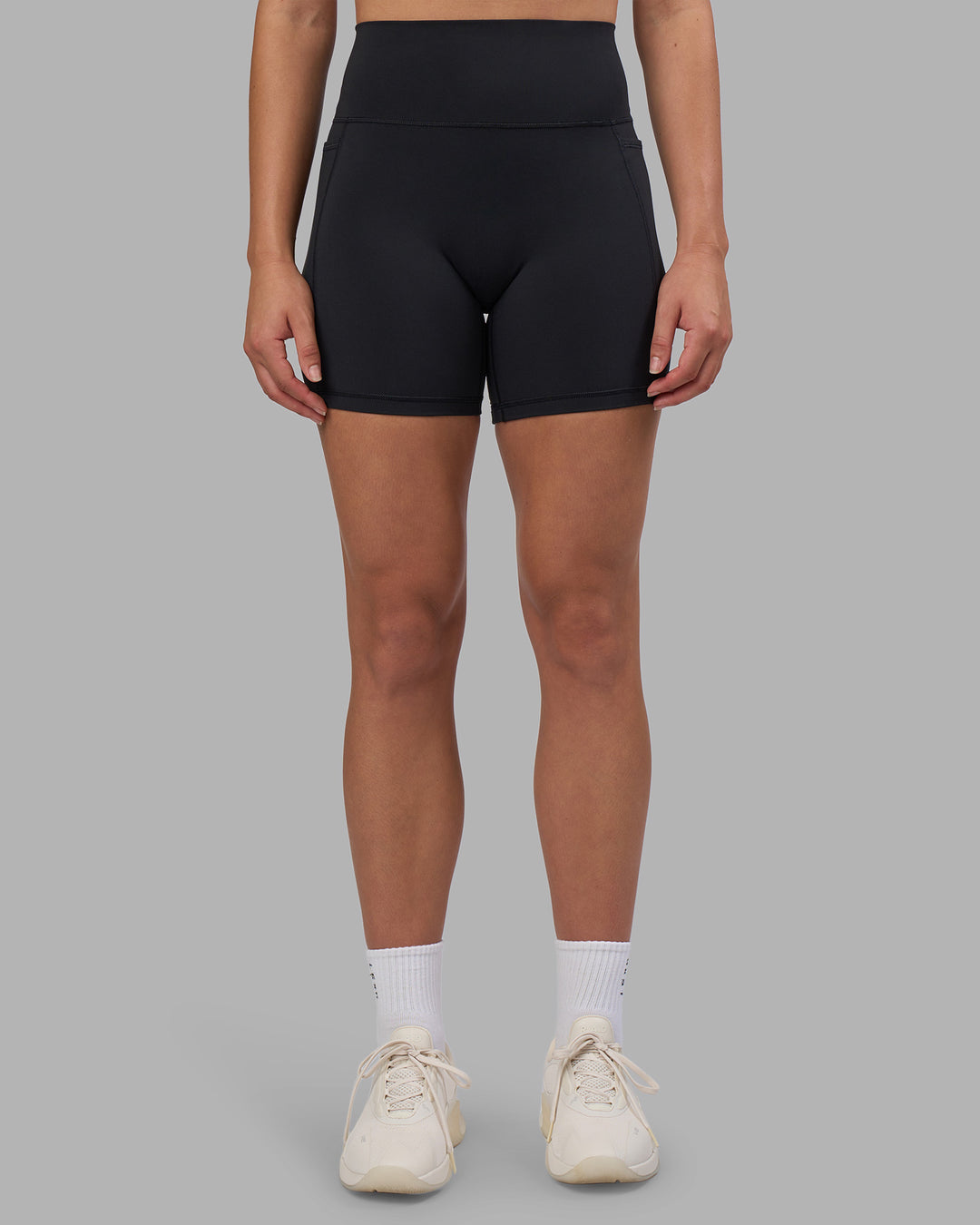 Woman wearing Fusion V-Contour Ultra High-Rise 6" Short Pockets - Black | Model:Charlize | Size:S - view 8
