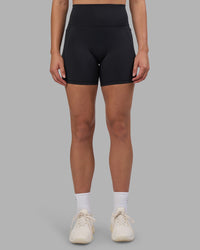 Woman wearing Fusion V-Contour Ultra High-Rise 6" Short Pockets - Black | Model:Charlize | Size:S | Thumbnail Index: 7