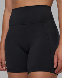 Woman wearing Fusion V-Contour Ultra High-Rise 6" Short Pockets - Black | Model:Charlize | Size:S | Thumbnail Index: 4