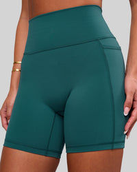 Woman wearing Fusion V-Contour Ultra High-Rise 6" Short Pockets - Transformative Teal | Model:Bianca | Size:S | Thumbnail Index: 4
