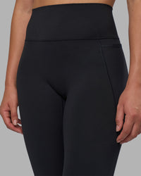 Woman wearing Fusion V-Contour Ultra High-Rise Full Length Legging Pockets - Black | Model:Charlize | Size:S | Thumbnail Index: 10