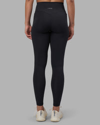 Woman wearing Fusion V-Contour Ultra High-Rise Full Length Legging Pockets - Black | Model:Charlize | Size:S | Thumbnail Index: 13