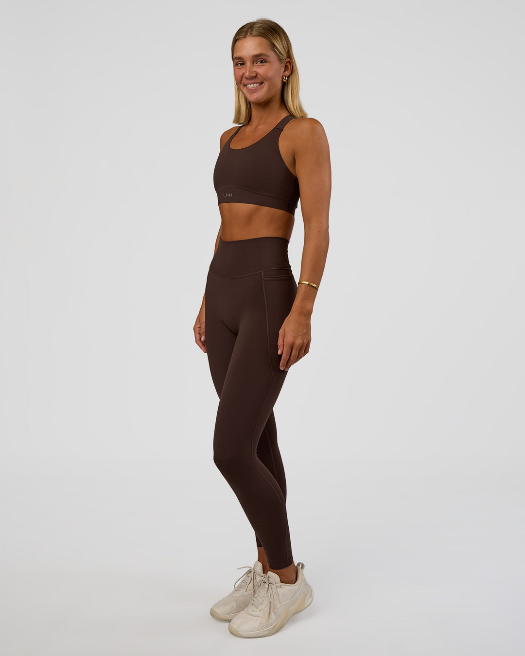 Woman wearing Fusion V-Contour Ultra High-Rise Full Length Legging Pockets - Hot Chocolate | Model:Amity | Size:S - view 1