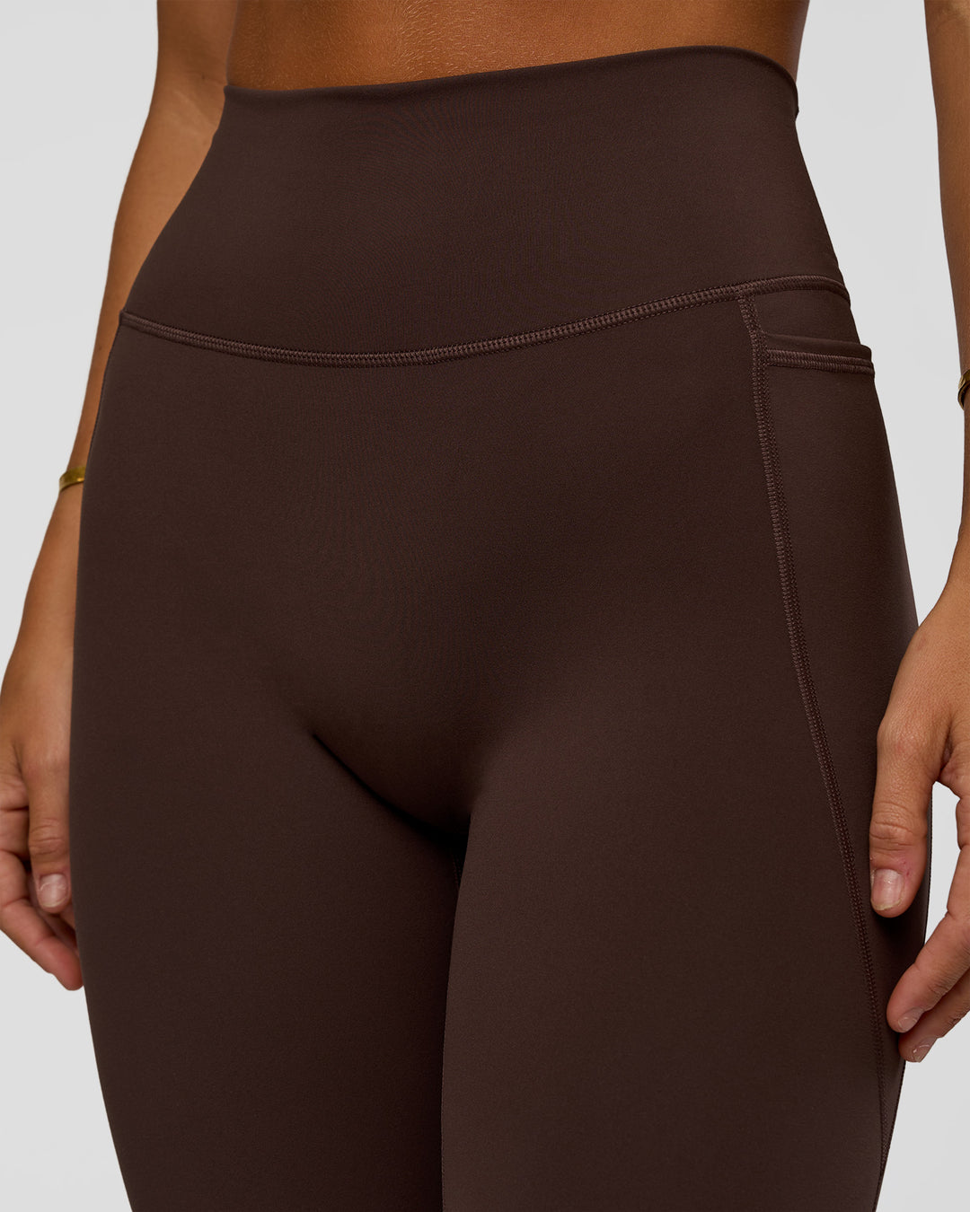 Woman wearing Fusion V-Contour Ultra High-Rise Full Length Legging Pockets - Hot Chocolate | Model:Amity | Size:S - view 6
