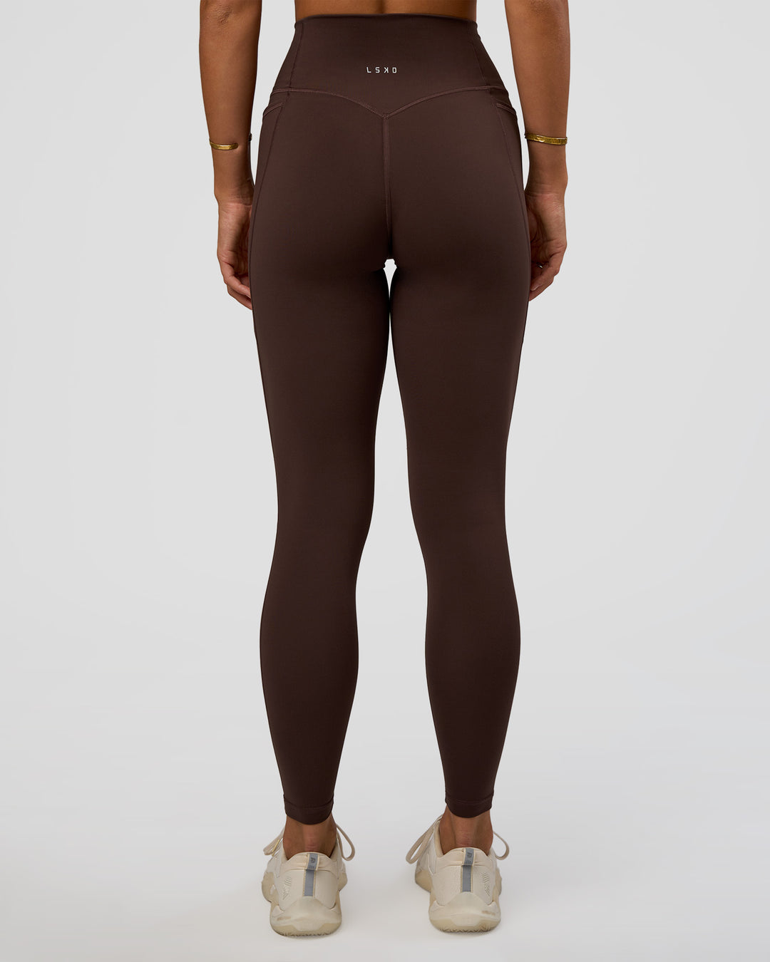 Woman wearing Fusion V-Contour Ultra High-Rise Full Length Legging Pockets - Hot Chocolate | Model:Amity | Size:S - view 2