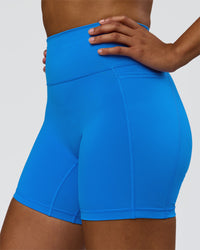 Woman wearing Fusion V-Contour Ultra High-Rise 6" Short Pockets - Palace Blue | Model:Rosie | Size:S | Thumbnail Index: 4