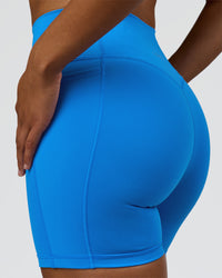 Woman wearing Fusion V-Contour Ultra High-Rise 6" Short Pockets - Palace Blue | Model:Rosie | Size:S | Thumbnail Index: 5
