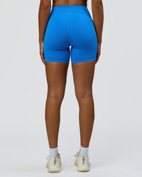 Woman wearing Fusion V-Contour Ultra High-Rise 6" Short Pockets - Palace Blue | Model:Rosie | Size:S | Thumbnail Index: 6