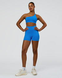 Woman wearing Fusion V-Contour Ultra High-Rise 4" Short Pockets - Palace Blue | Model:Rosie | Size:S | Thumbnail Index: 3