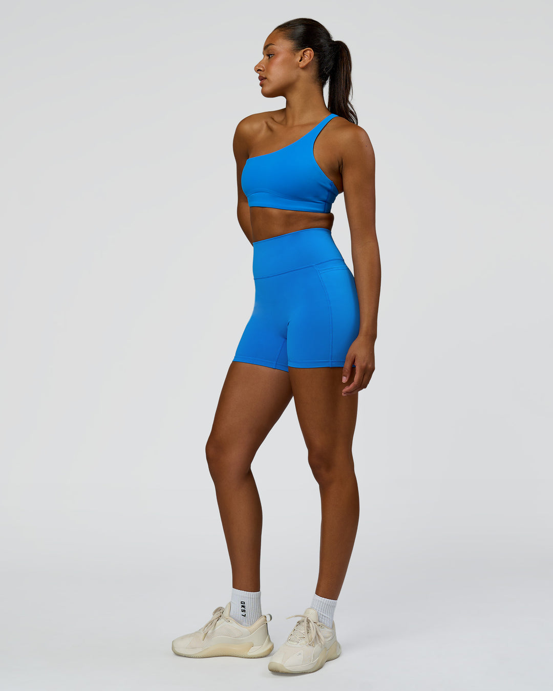 Woman wearing Fusion V-Contour Ultra High-Rise 4" Short Pockets - Palace Blue | Model:Rosie | Size:S - view 7