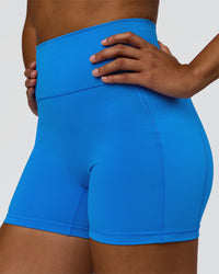 Woman wearing Fusion V-Contour Ultra High-Rise 4" Short Pockets - Palace Blue | Model:Rosie | Size:S | Thumbnail Index: 8