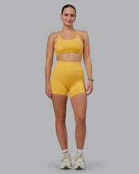 Woman wearing Fusion Ultra High-Rise 4" Short - Banana Cream | Model:Lillie | Size:S | Thumbnail Index: 0