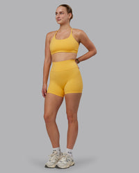Woman wearing Fusion Ultra High-Rise 4" Short - Banana Cream | Model:Lillie | Size:S | Thumbnail Index: 4