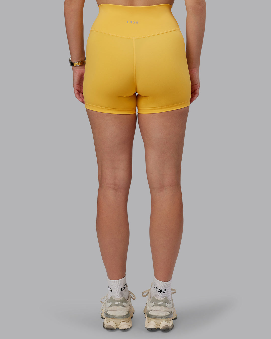 Woman wearing Fusion Ultra High-Rise 4" Short - Banana Cream | Model:Lillie | Size:S - view 7