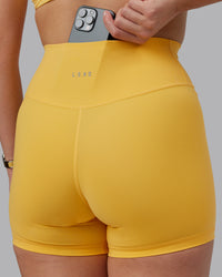 Woman wearing Fusion Ultra High-Rise 4" Short - Banana Cream | Model:Lillie | Size:S | Thumbnail Index: 3