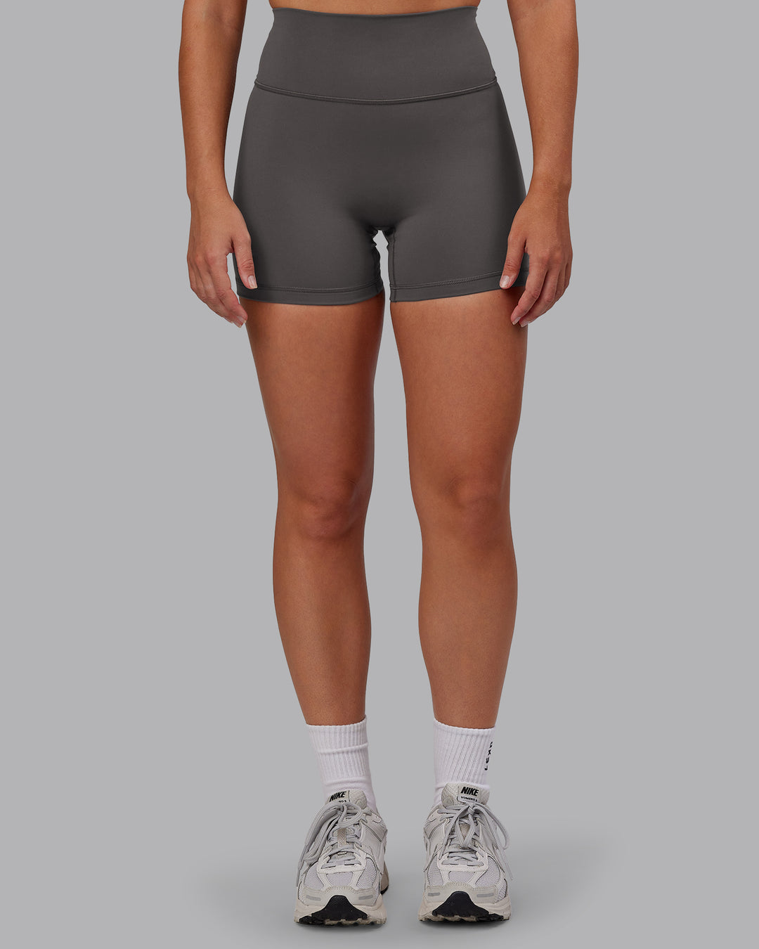 Woman wearing Fusion Ultra High-Rise 4" Short - Dark Storm | Model:Hannah | Size:S - view 1