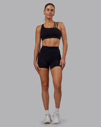 Woman wearing Fusion Ultra High-Rise 4" Short - Black | Model:Hannah | Size:S | Thumbnail Index: 5