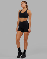 Woman wearing O.G. Fusion Ultra High-Rise 4" Short Pockets - Black | Model:Milly | Size:S | Thumbnail Index: 4