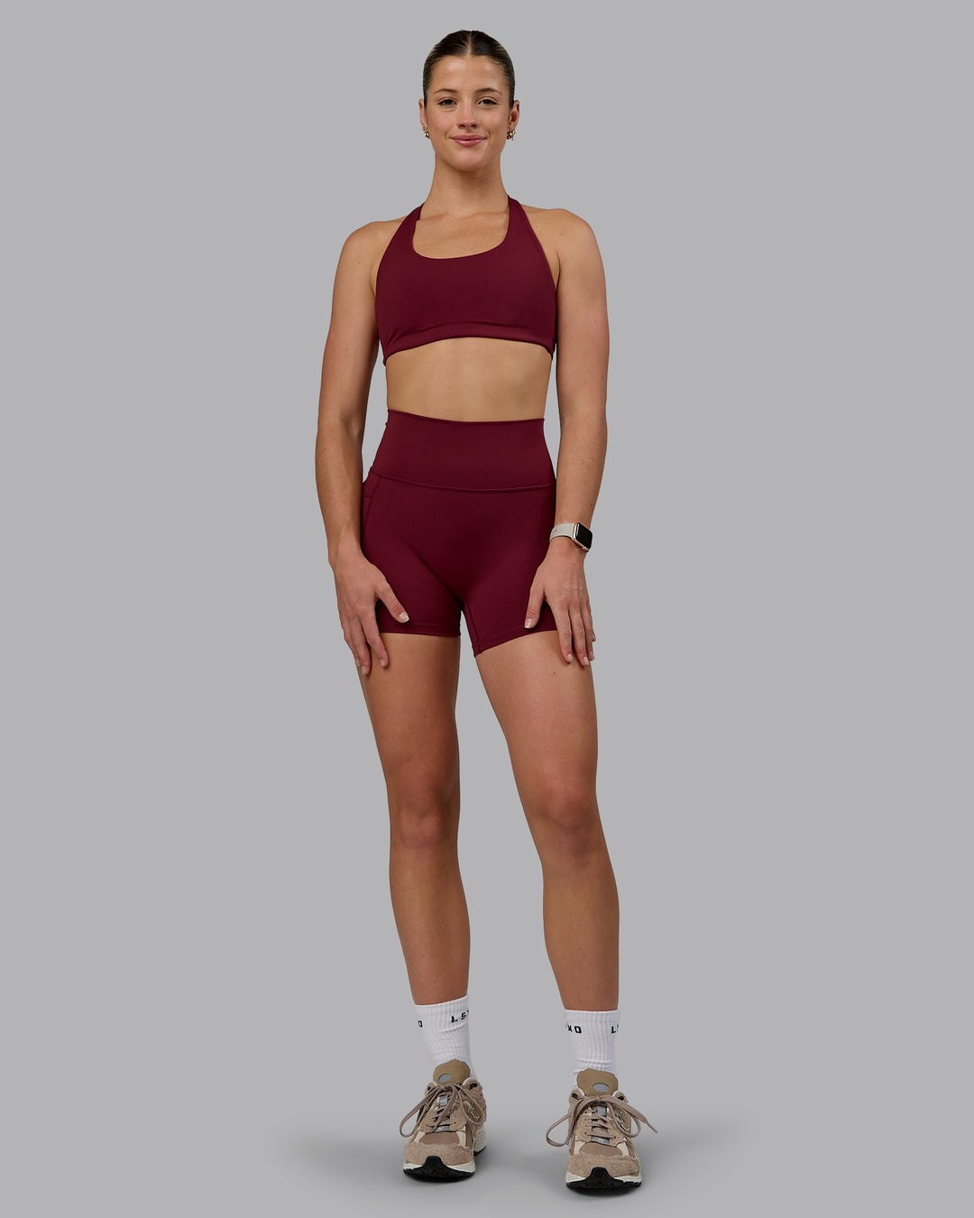 Woman wearing Fusion Ultra High-Rise 4" Short Pockets - Cordovan | Model:Chloe | Size:XS - view 4