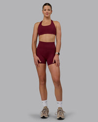 Woman wearing Fusion Ultra High-Rise 4" Short Pockets - Cordovan | Model:Chloe | Size:XS | Thumbnail Index: 3
