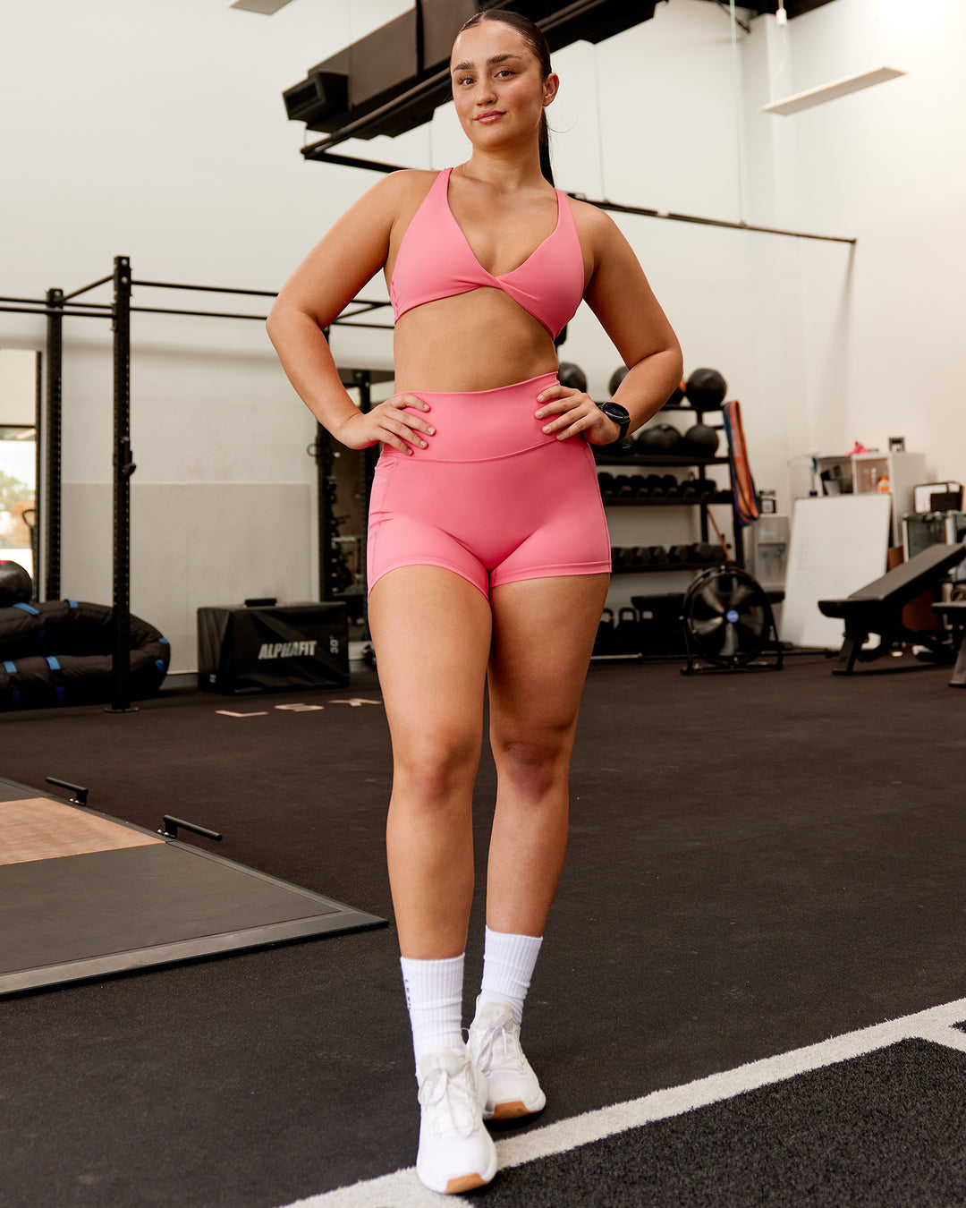 Woman wearing Fusion Ultra High-Rise 4" Short Pockets - Pink Lemonade | Model:Charlotte | Size:S - view 3