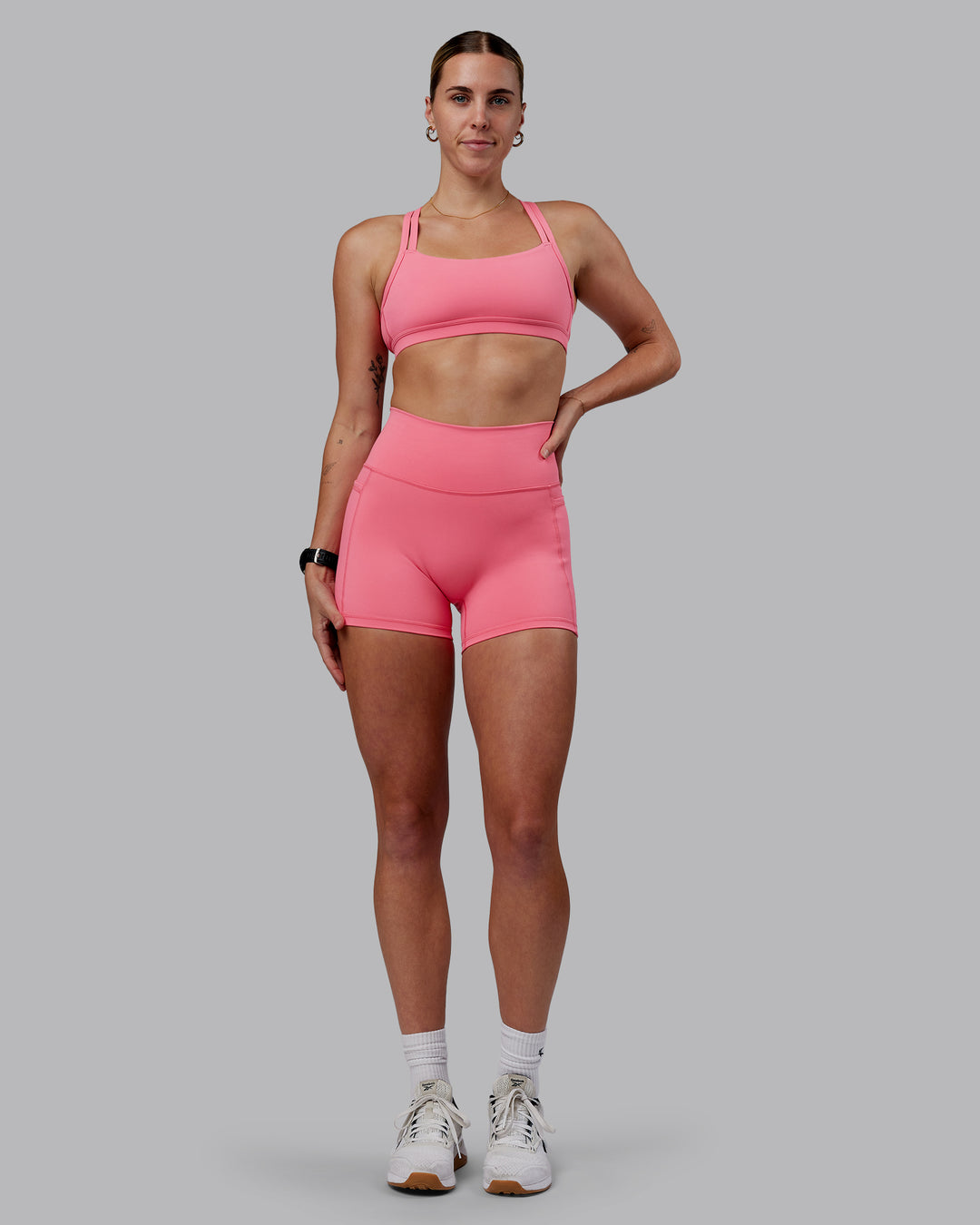 Woman wearing Fusion Ultra High-Rise 4" Short Pockets - Pink Lemonade | Model:Shae | Size:S - view 1