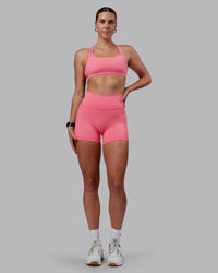 Woman wearing Fusion Ultra High-Rise 4" Short Pockets - Pink Lemonade | Model:Shae | Size:S | Thumbnail Index: 0