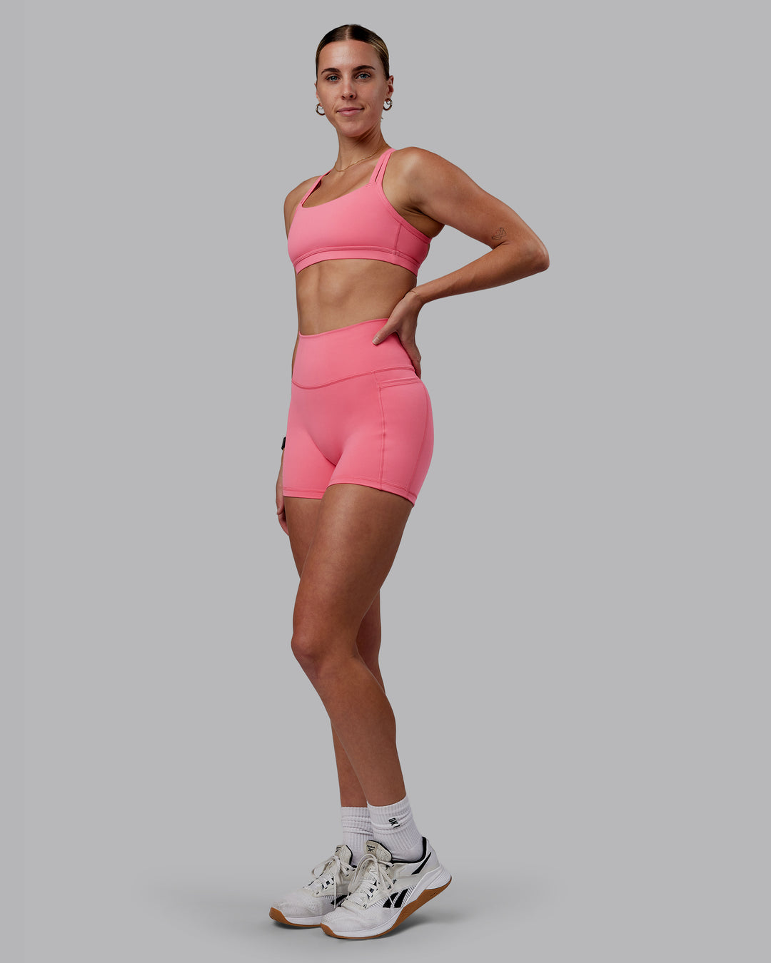 Woman wearing Fusion Ultra High-Rise 4" Short Pockets - Pink Lemonade | Model:Shae | Size:S - view 8