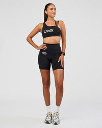 Woman wearing Galvanise Hype Graphic Sports Bra 2.0 - Black-Alloy | Model:Rhiley | Size:S | Thumbnail Index: 6
