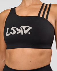 Woman wearing Galvanise Hype Graphic Sports Bra 2.0 - Black-Alloy | Model:Rhiley | Size:S | Thumbnail Index: 5
