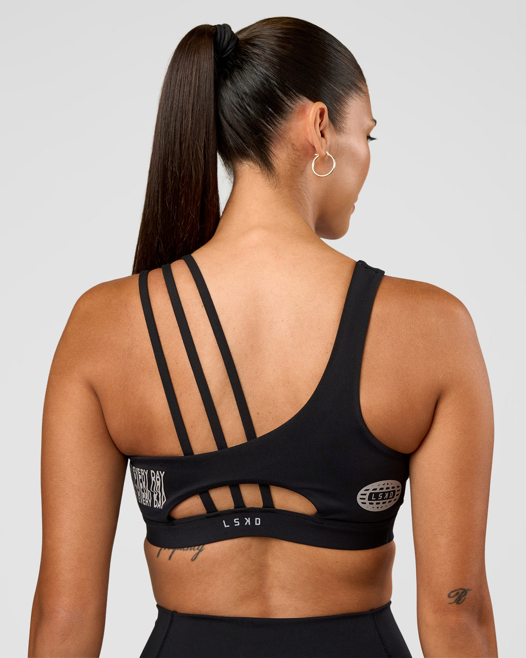 Woman wearing Galvanise Hype Graphic Sports Bra 2.0 - Black-Alloy | Model:Rhiley | Size:S - view 8