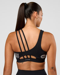 Woman wearing Galvanise Hype Graphic Sports Bra 2.0 - Black-Alloy | Model:Rhiley | Size:S | Thumbnail Index: 7