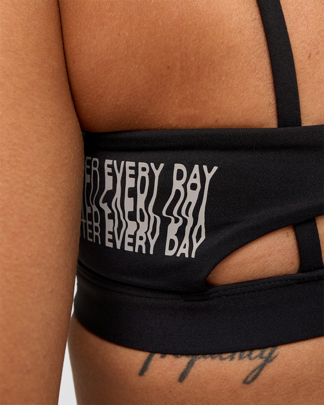 Woman wearing Galvanise Hype Graphic Sports Bra 2.0 - Black-Alloy | Model:Rhiley | Size:S - view 5