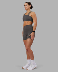 Woman wearing Galvanise Sports Bra 2.0 - Dark Storm | Model:Keisha | Size:S | Thumbnail Index: 3