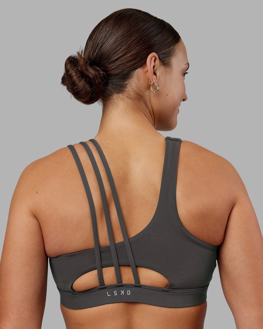 Woman wearing Galvanise Sports Bra 2.0 - Dark Storm | Set:true | Angle:back | Model:Keisha | Size:S - view 1