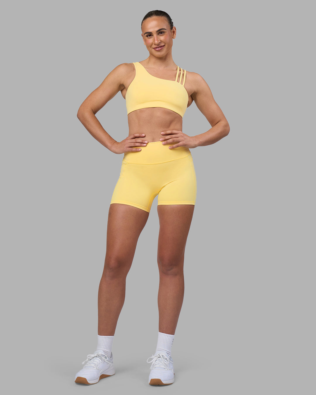 Woman wearing Galvanise Sports Bra 2.0 - Lemon | Model:Sophie | Size:S - view 3
